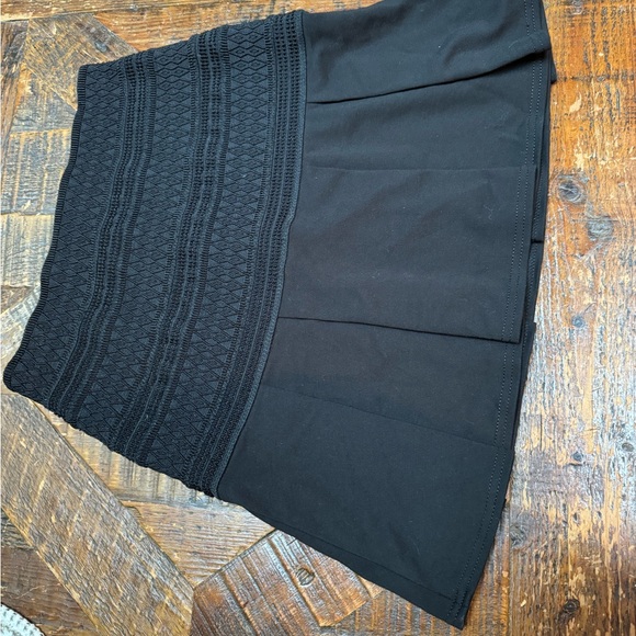 Bebe mini skirt fit and flare black with corset detail on top. Size 2 - Picture 4 of 5